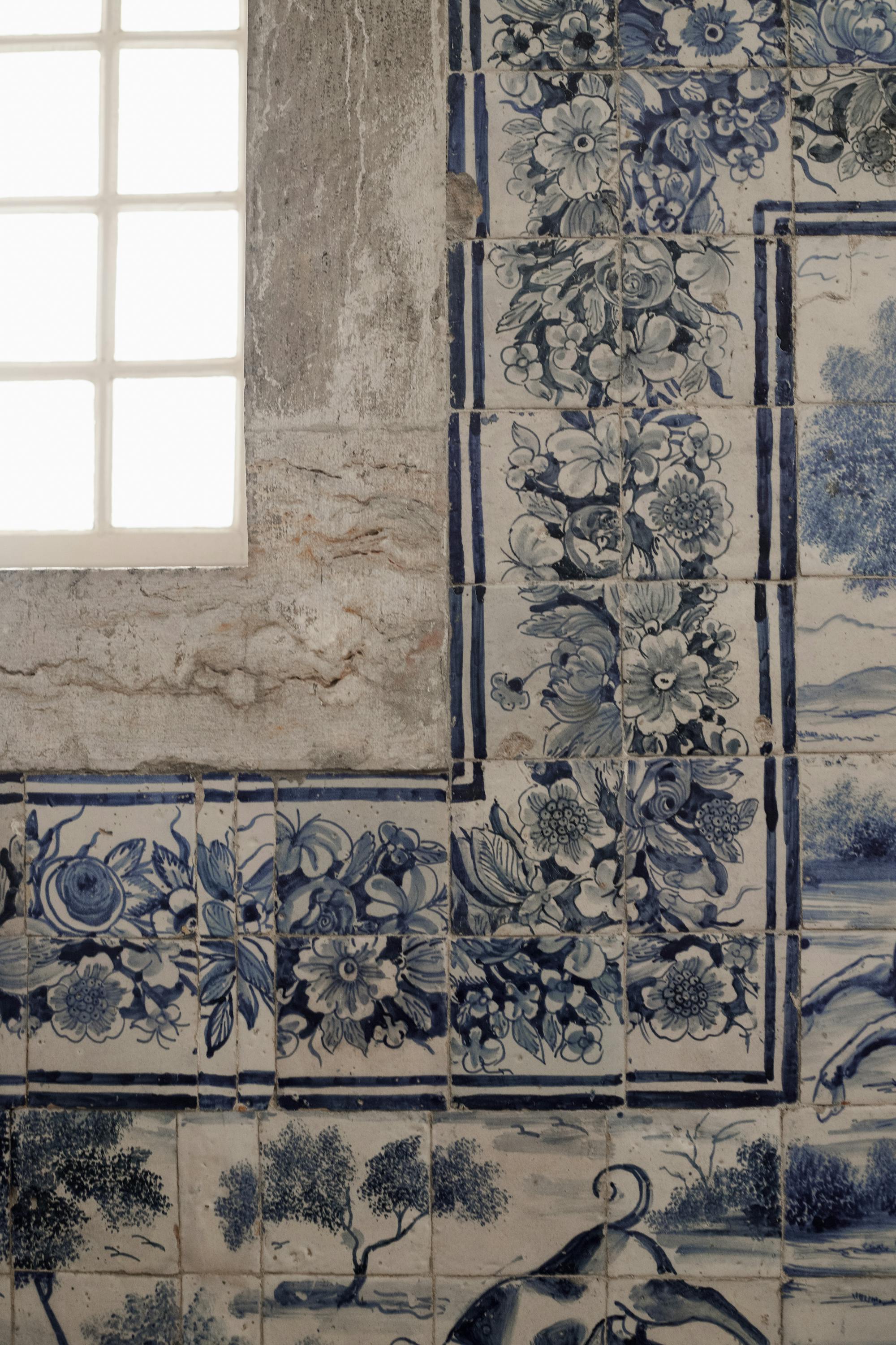 Close-up of blue azulejo tiles with floral patterns
