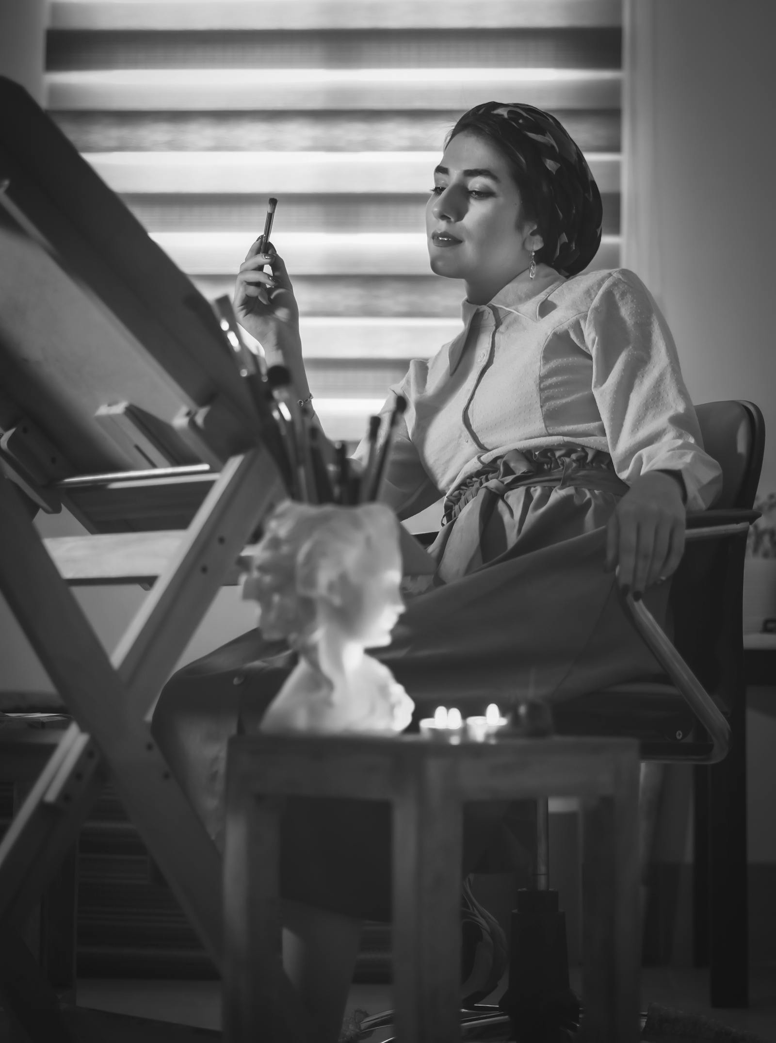 Black and white portrait of a designer in her studio