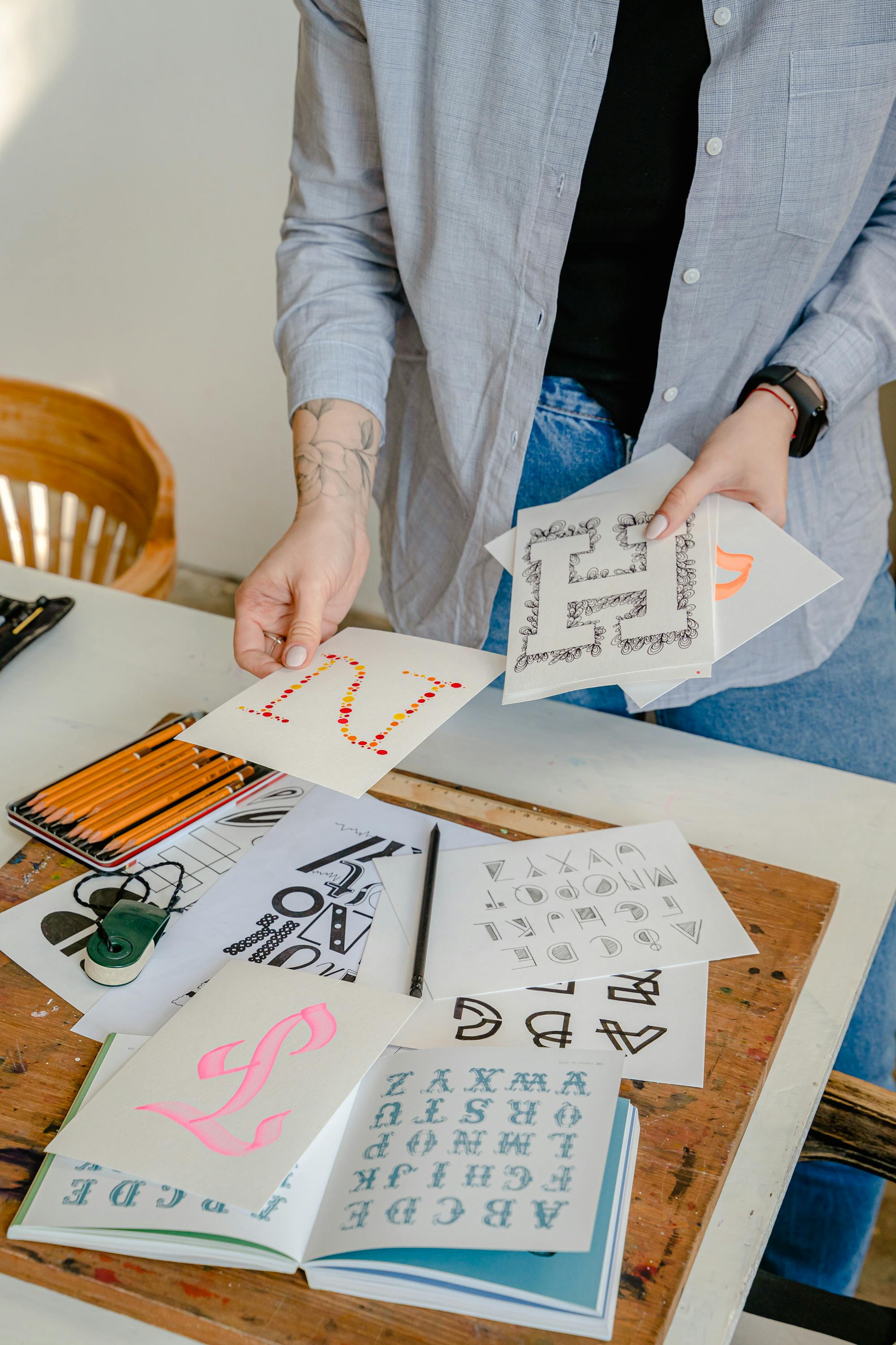 A creative workspace with calligraphy tools